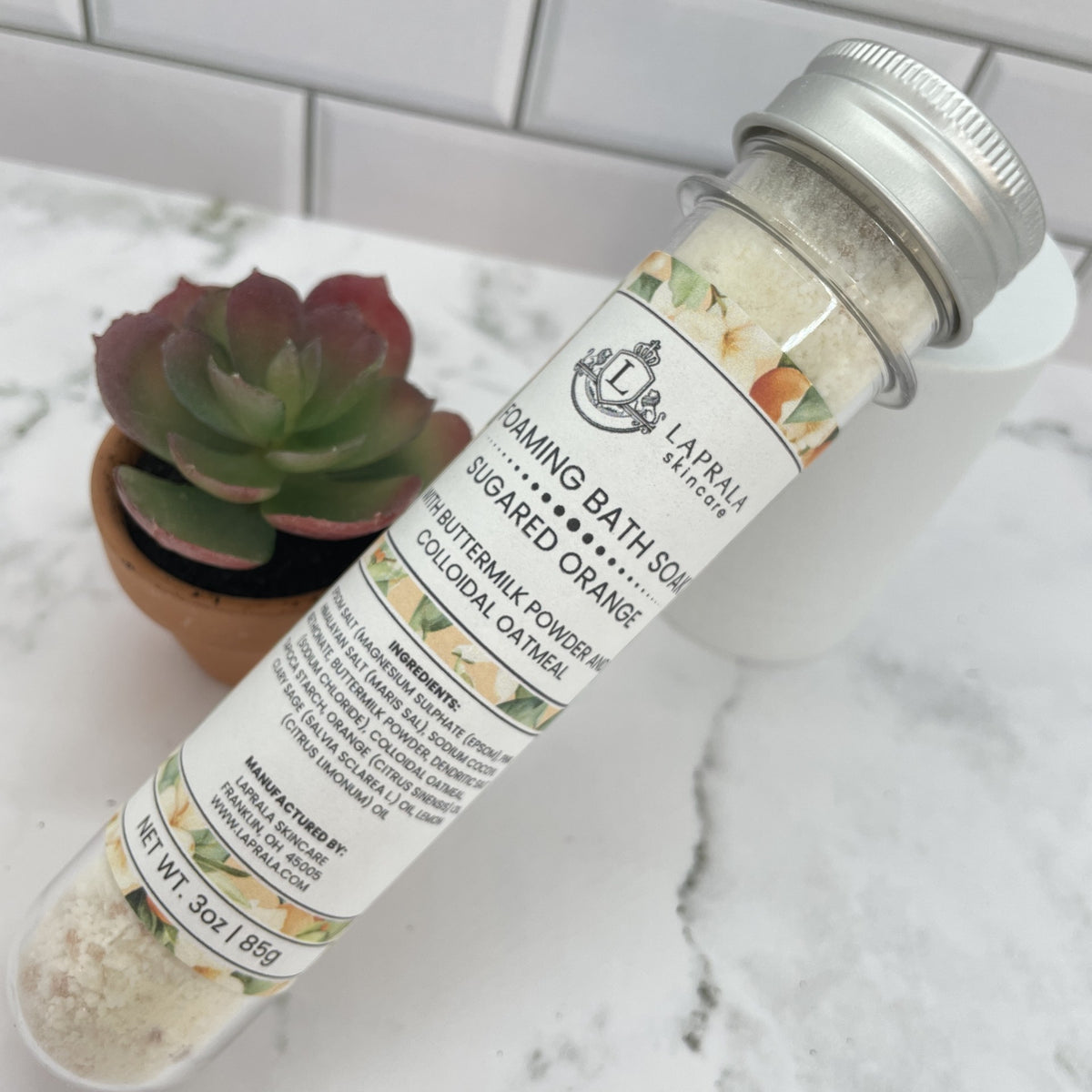 a foaming bath soak with buttermilk powder that is single use.  The scent is orange and other citrus essential oils.